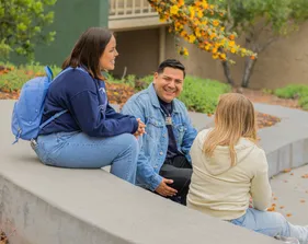 Students chatting together outside