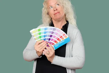 Renee holding a pantone swatch book