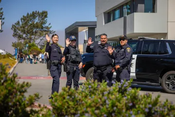 A group of UPD officers standing together outside the OSU