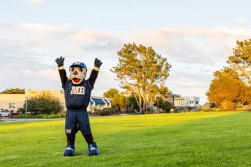 Monte Rey On CSUMB with hands up