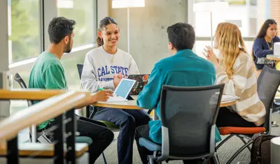 Four students studying at table