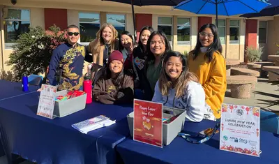 President Vanya Quiñones and members of Asian Pacific Islander Affinity group outside the Campus Dining Commons
