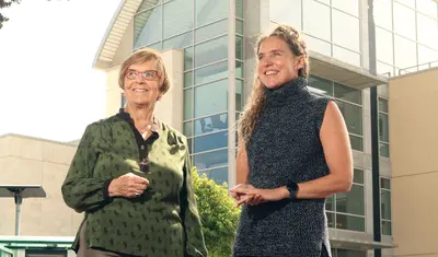 From left: Konny Murray and Jacqueline Grallo, interim library dean, outside the Tanimura & Antle Family Memorial Library at CSUMB. Photo by Randy Tunnell