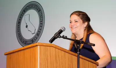 Vayna at podium during Day of Welcome