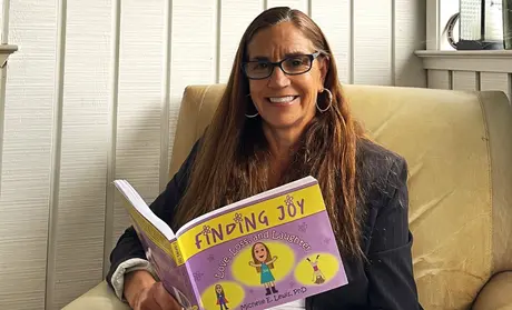 Michelle Lewis with book 