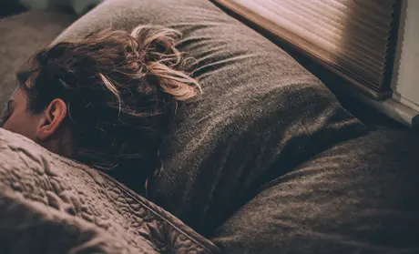 A woman sleeping | photo by Gregory Pappas