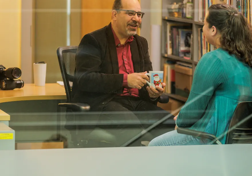 Student and Teacher in office window